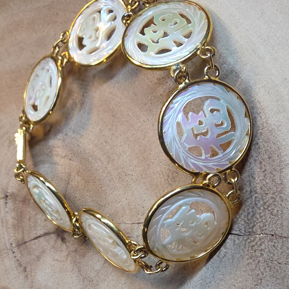 Vintage Chinese link bracelet featuring carved mother-of-pearl Panels